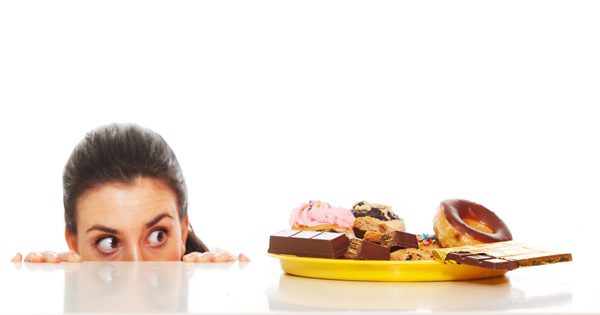 woman tempted to eat cookies containing herself