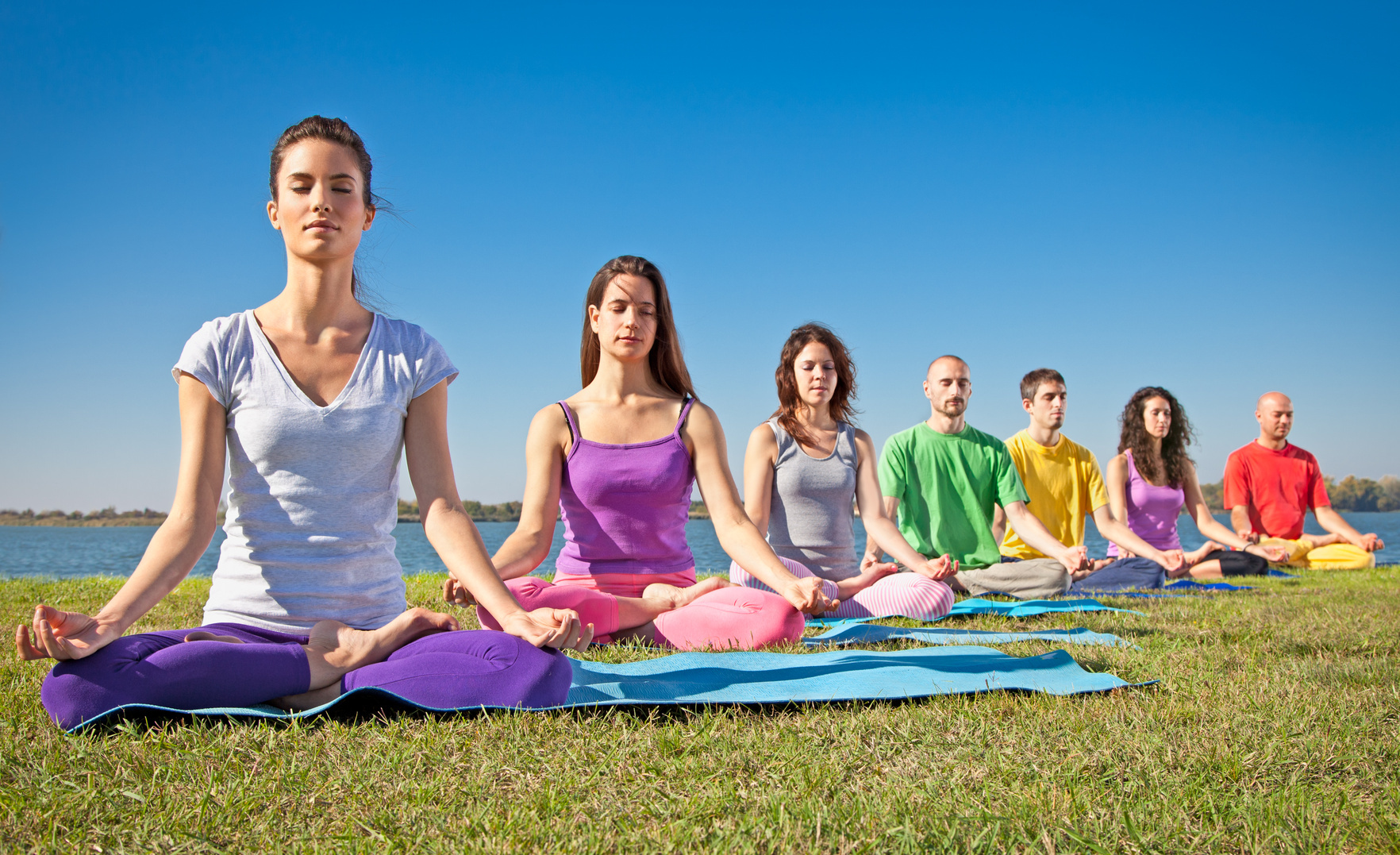 Friends meditating outside