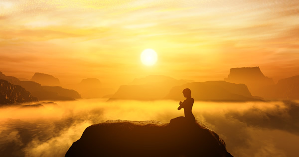 meditating man on hilltop