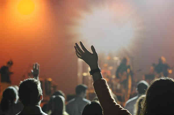 fans cheering at concert