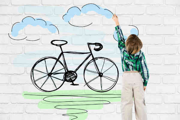boy drawing on a wall
