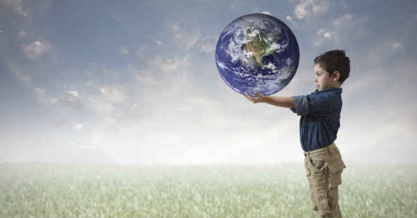 boy holding the world