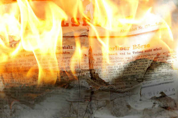 burning newspaper