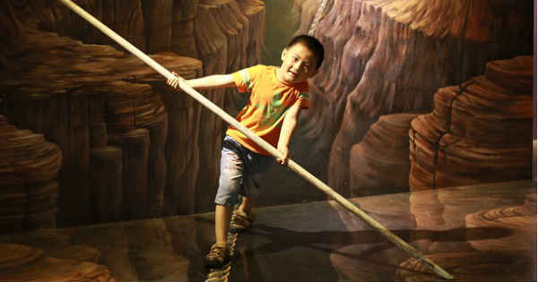 boy balancing on rope
