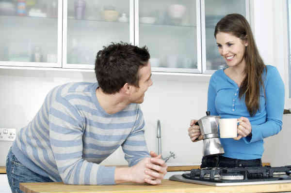 a couple making coffee