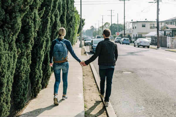 a couple walking on a quiet street