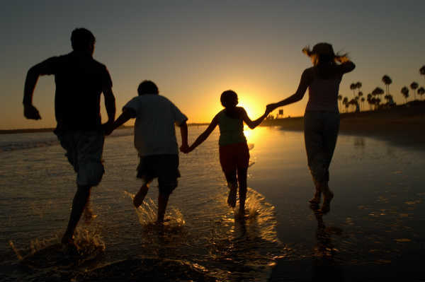 family enjoying themselves on a beach