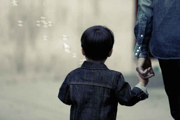 father and son walking