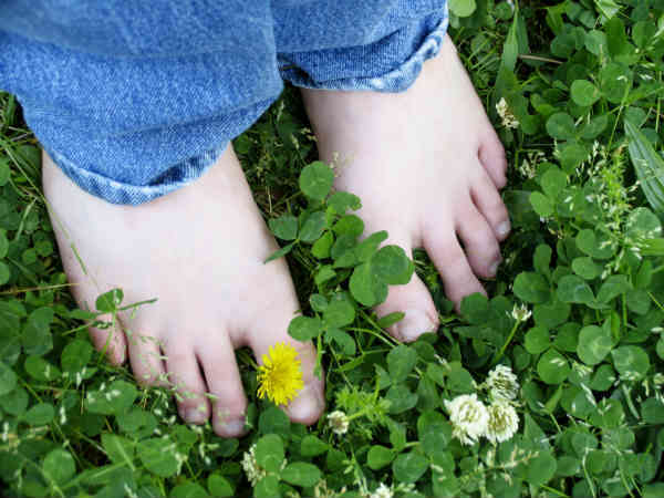 feet standing on grass