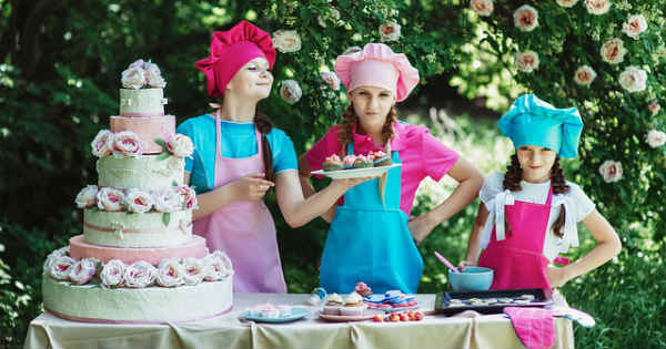 girl cooks making a cake