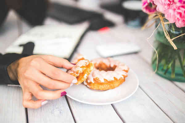 woman eating donut