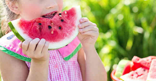 girl eating watermelon mindfully