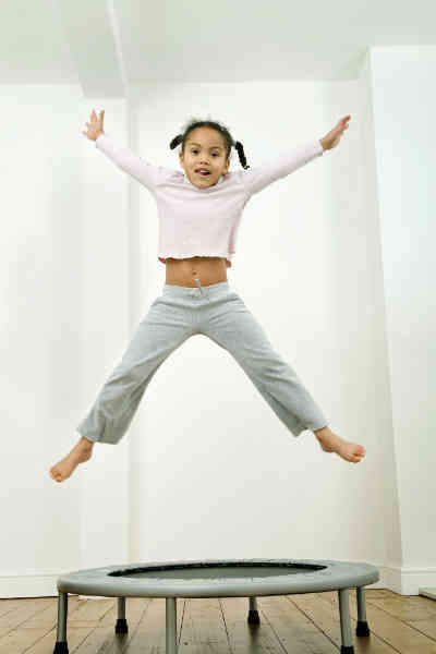 girl jumping on trampoline