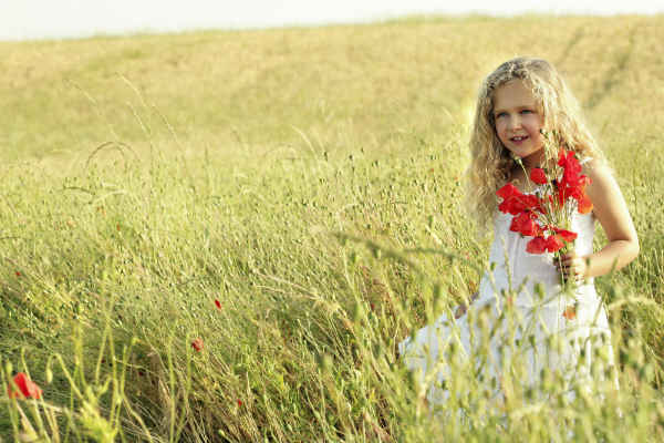 young girl picking flowers