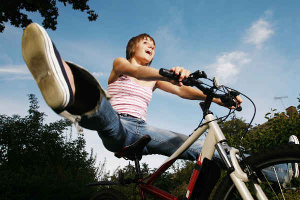 a lady riding a bicycle