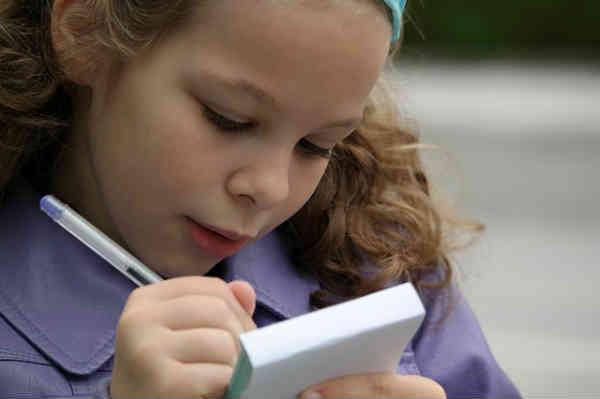 girl writing stuff down
