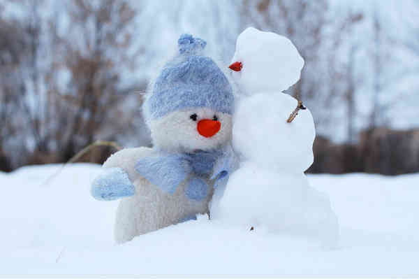 happy snowmen enjoying time together