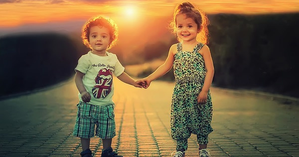 boy and girl holding hands happy