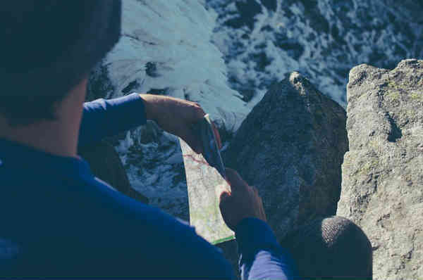 man sitting looking down into the abyss