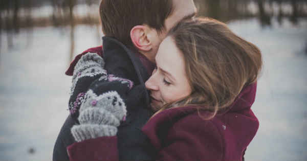 a woman and a man hugging lovingly