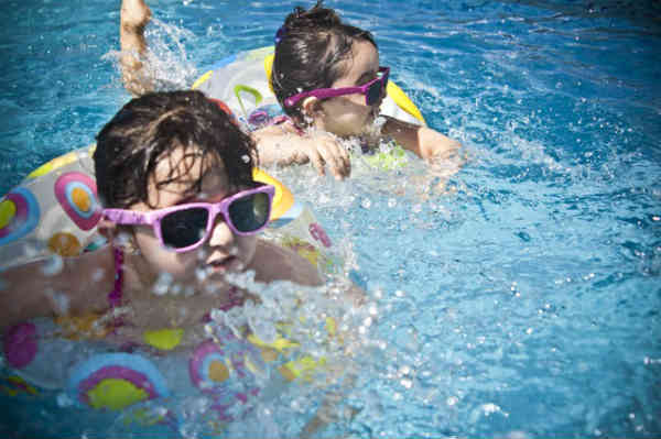 children playing in the pool