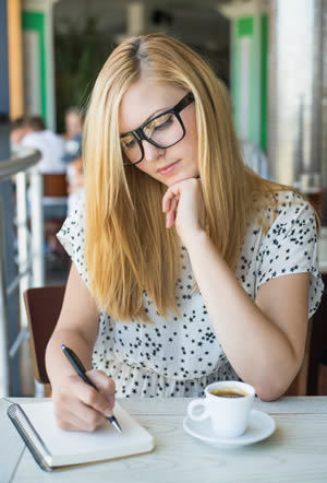 girl writing letter out of concern