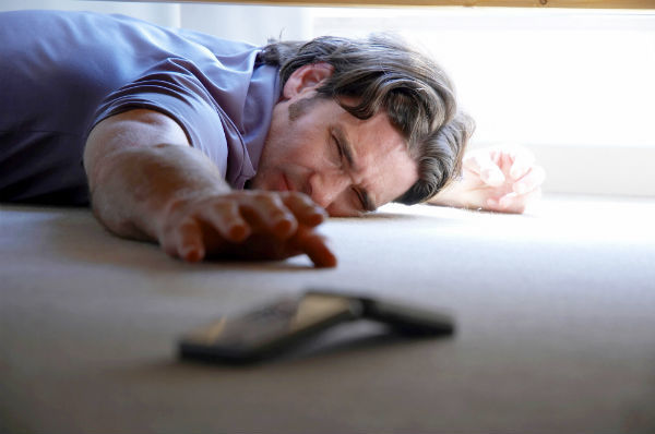 man dropped smartphone behind bed