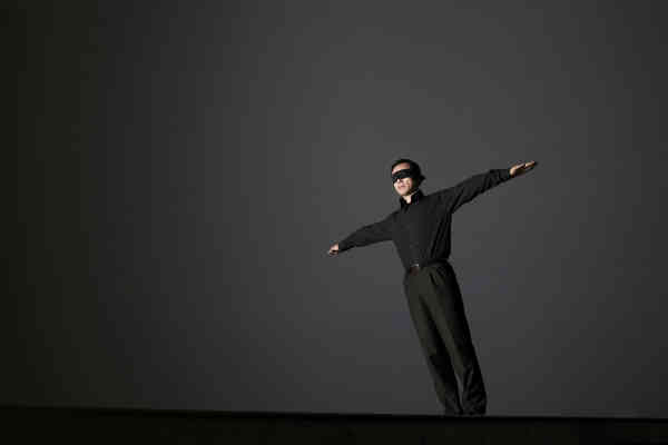 man with blindfold on edge