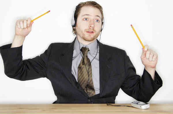 man drumming with pencils