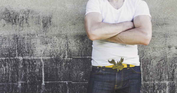 man standing with arms folded