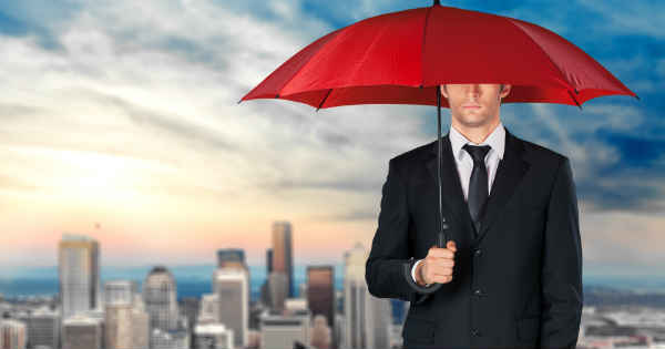 man hiding under an umbrella