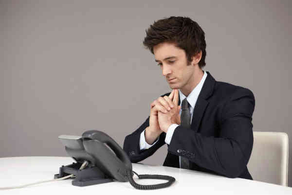 man waiting for the telephone to ring