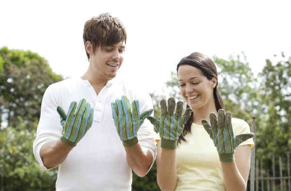 man and woman comparing hands