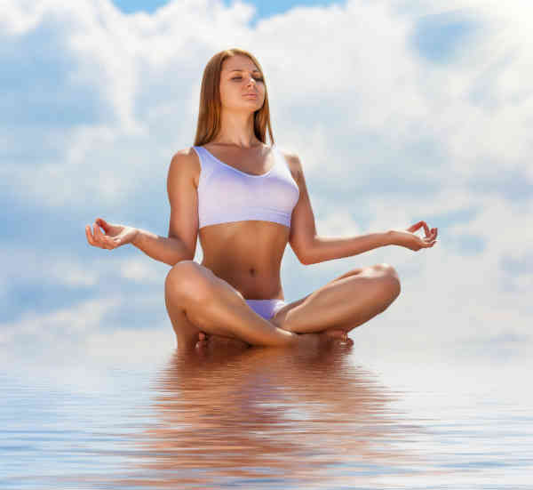 woman meditating on water