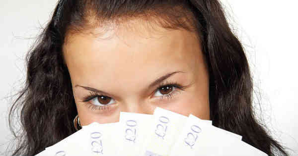 woman with lots of money in hands