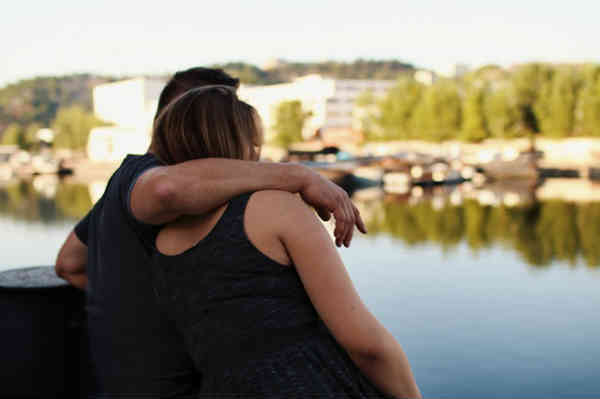 two people in an hug embrace