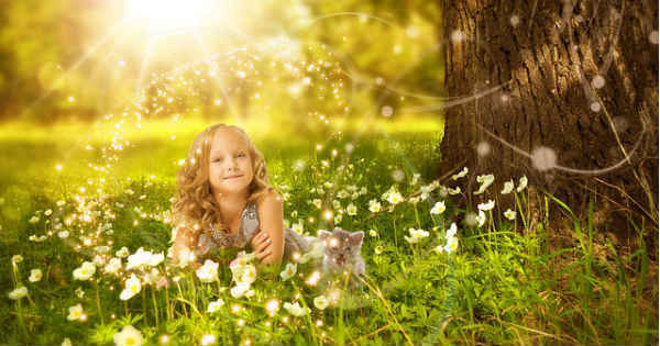 girl smiling on grass