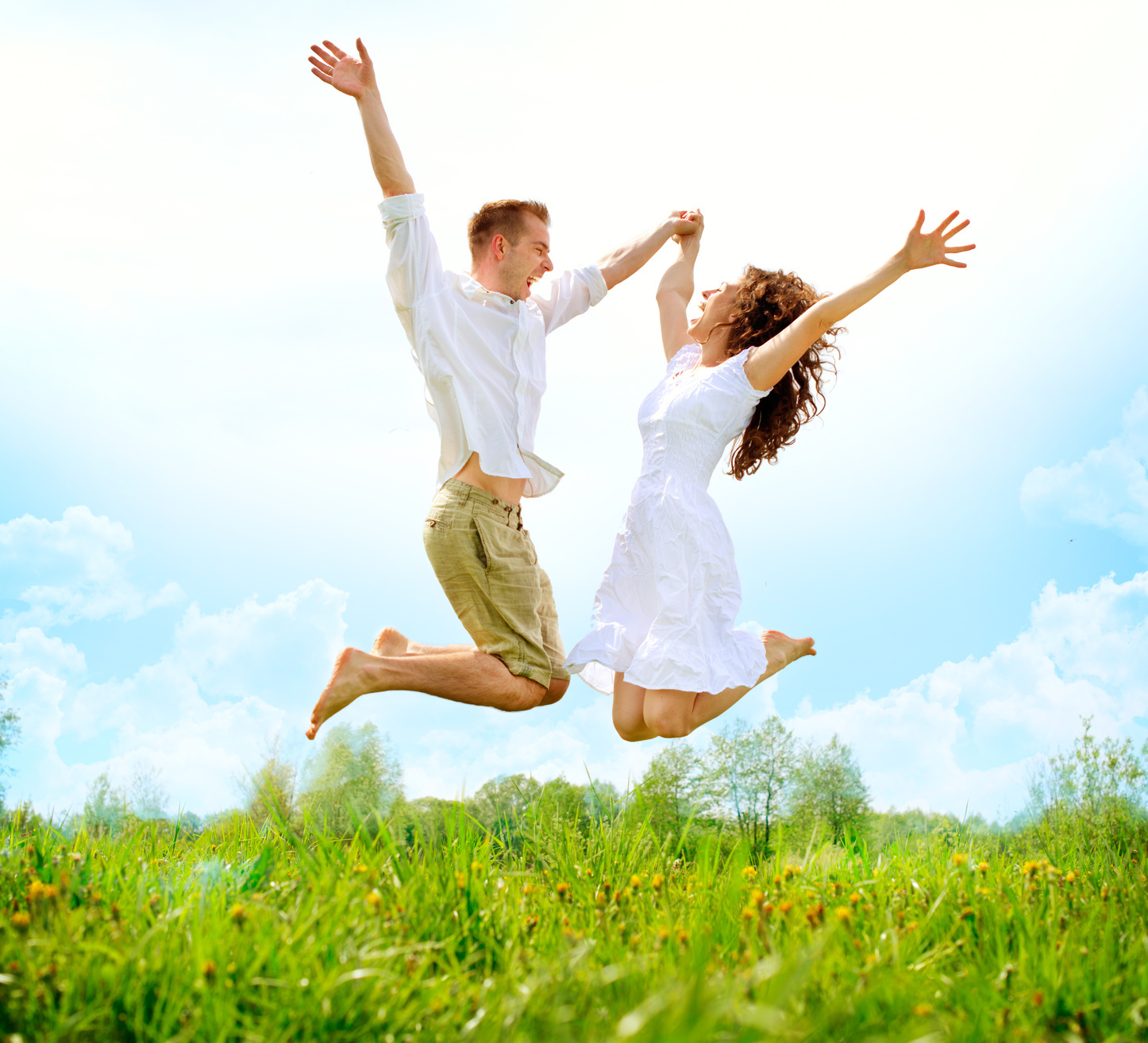 positive couple jumping