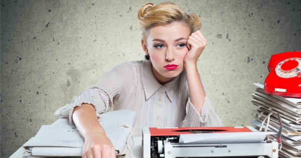 sad woman sitting at her work desk