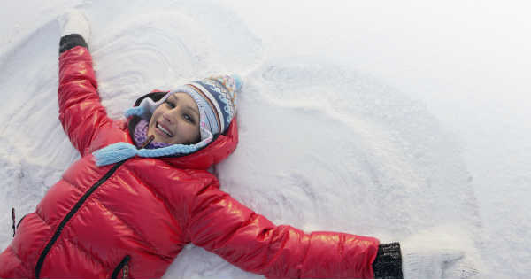 woman making a snow angel