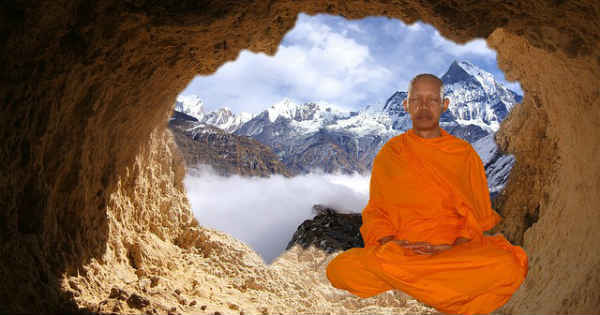 spiritual monk meditating inside mountain