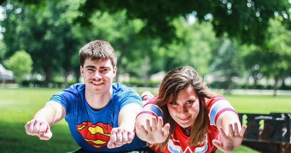 superman and superwoman flying together
