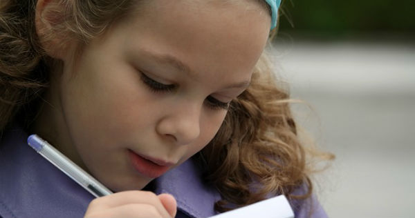 girl writing here mission