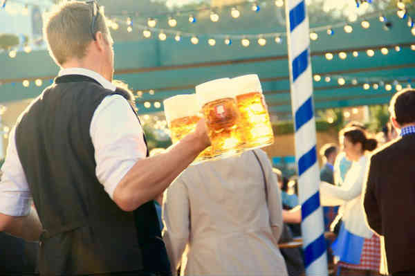 waiter bringing beer to customers