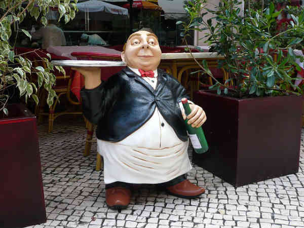 waiter carrying an empty plate