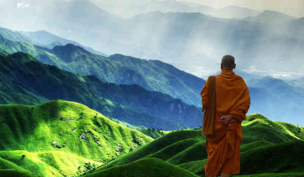 budhist man on a hill meditating
