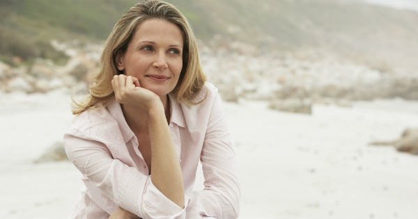 woman sitting alone on a beach