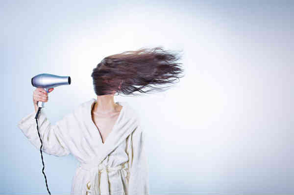 hairdrying woman