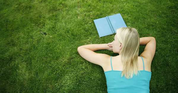 woman enjoying herself on a grass field