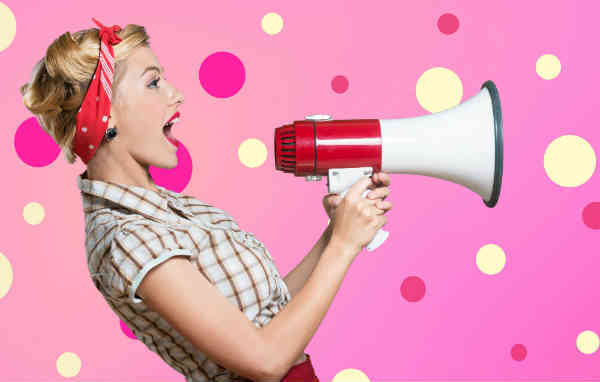 woman speaking through loudspeaker